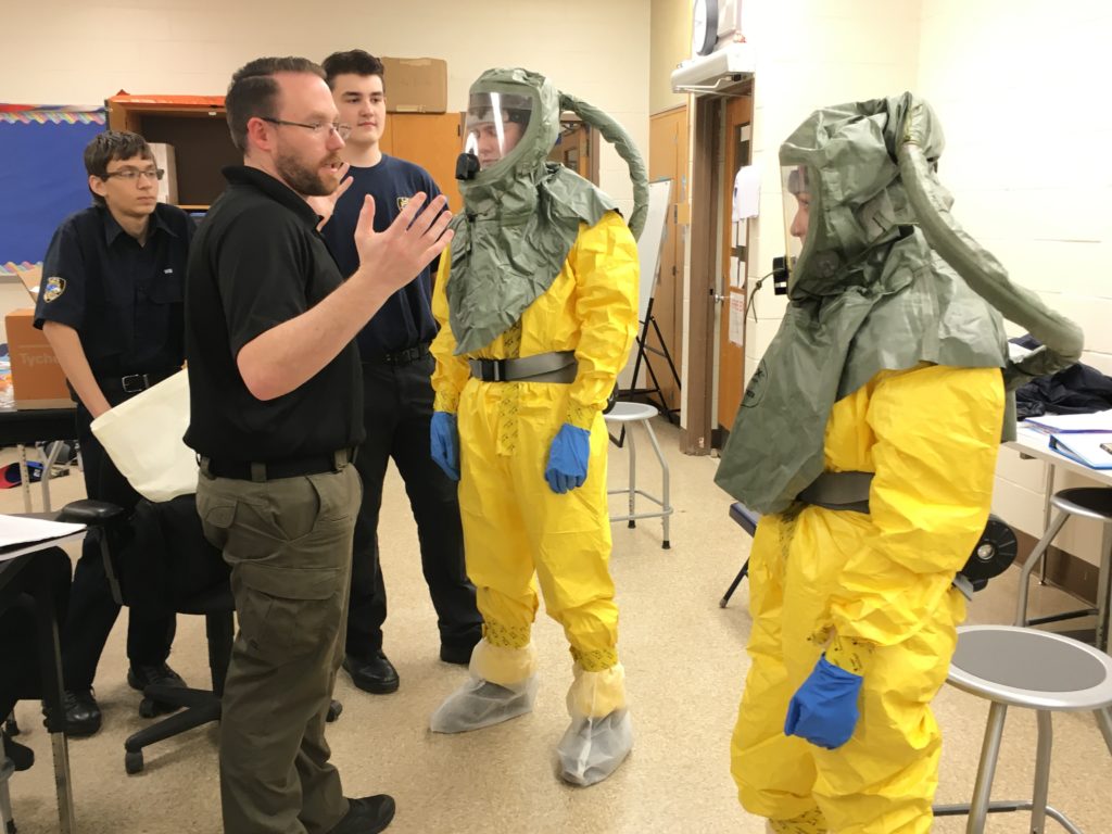Criminal Justice instructor directs students in protective gear