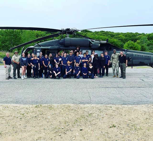 Vinal Tech Criminal Justice students pose in front of US Army helicopter