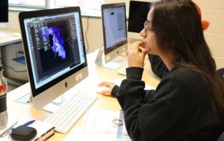 Graphics student works on a design project