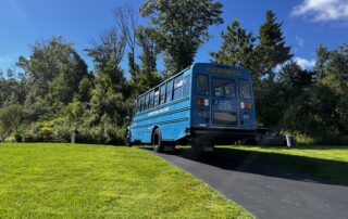 Image of blue CTECS Student Workforce bus from A.I. Prince Technical High School
