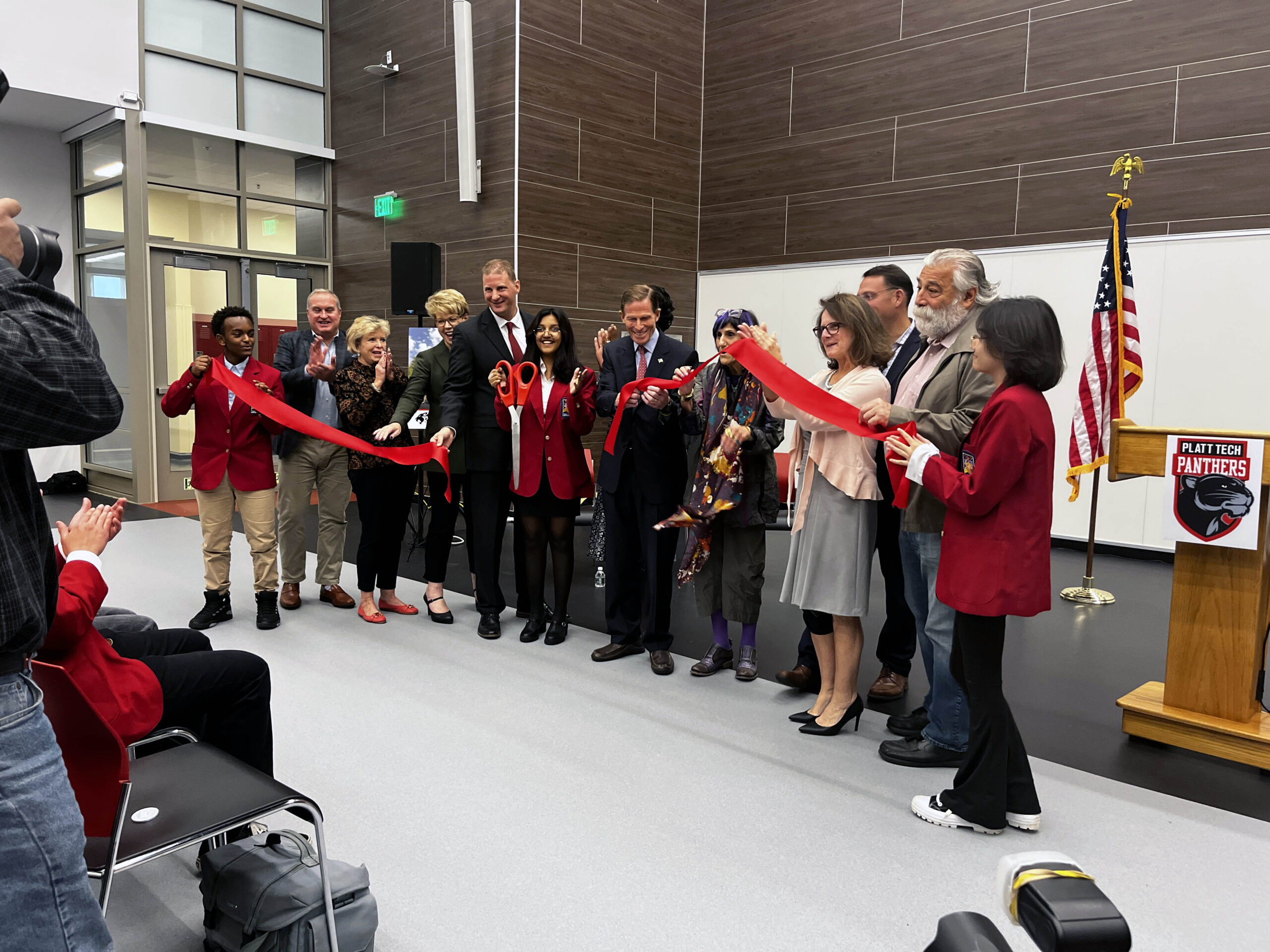 Image of special guests and SkillsUSA students cutting the ribbon at Platt Tech Grand Opening