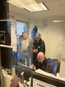 precision machining teacher Steve Bova showing Observatory representatives the Master Cam toolpath