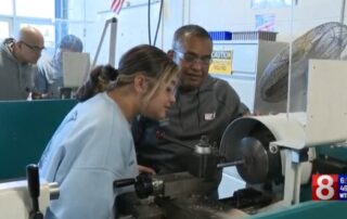 Students and parents participating in workplace event